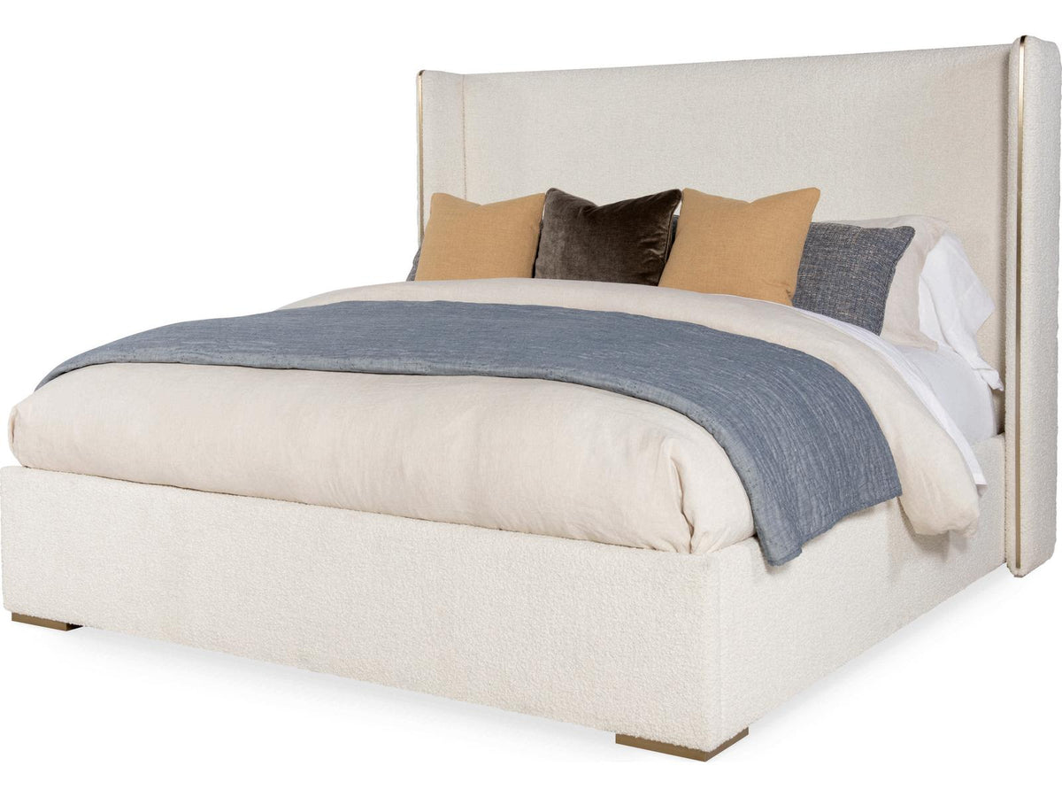 Cadence Upholstered Wing King Bed with Antique Brass Trim
