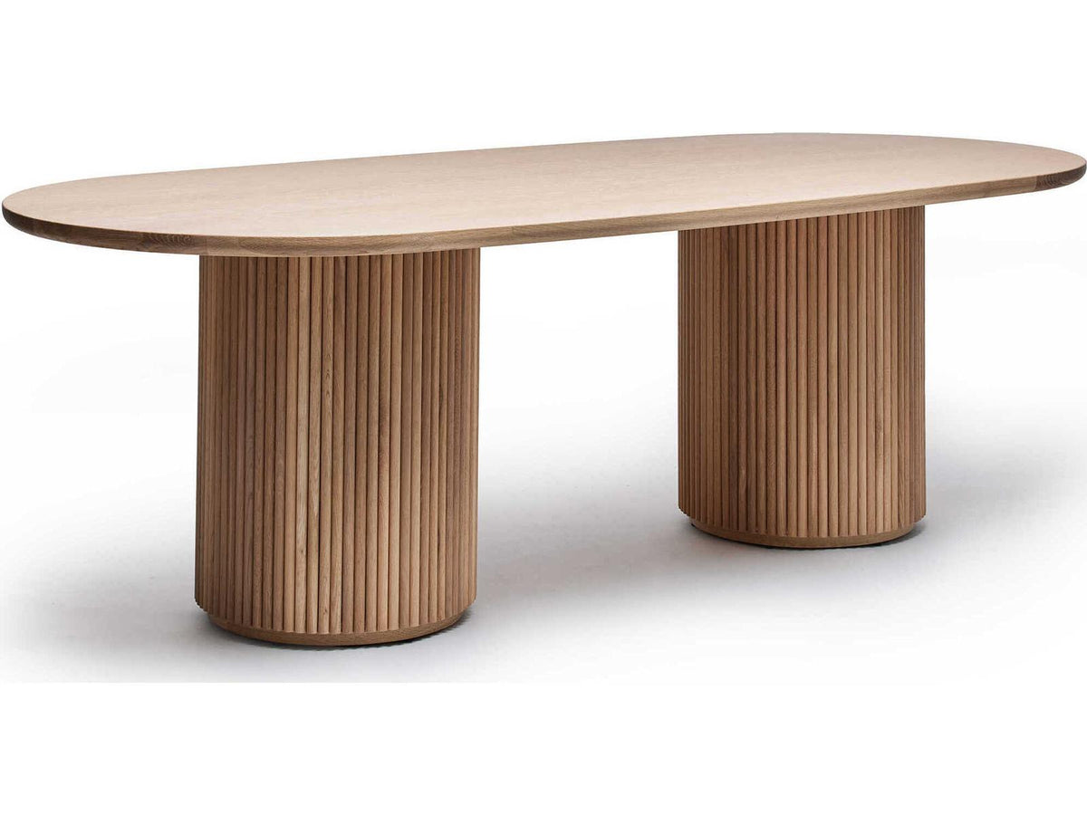 Laurel Oval Wood Saddle Dining Table with Fluted Pedestals